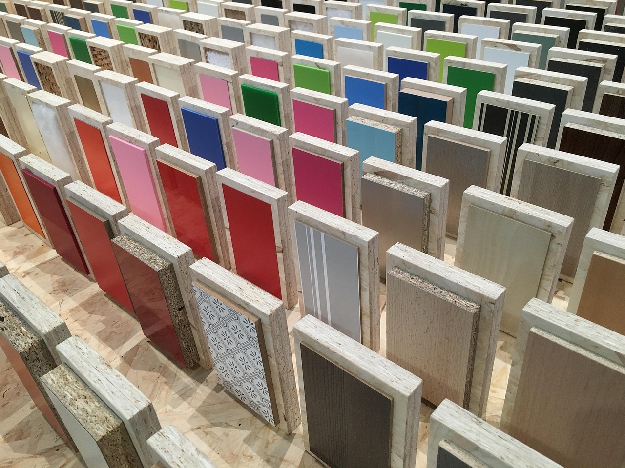Rows of colour sample boards in wooden frames standing upright
