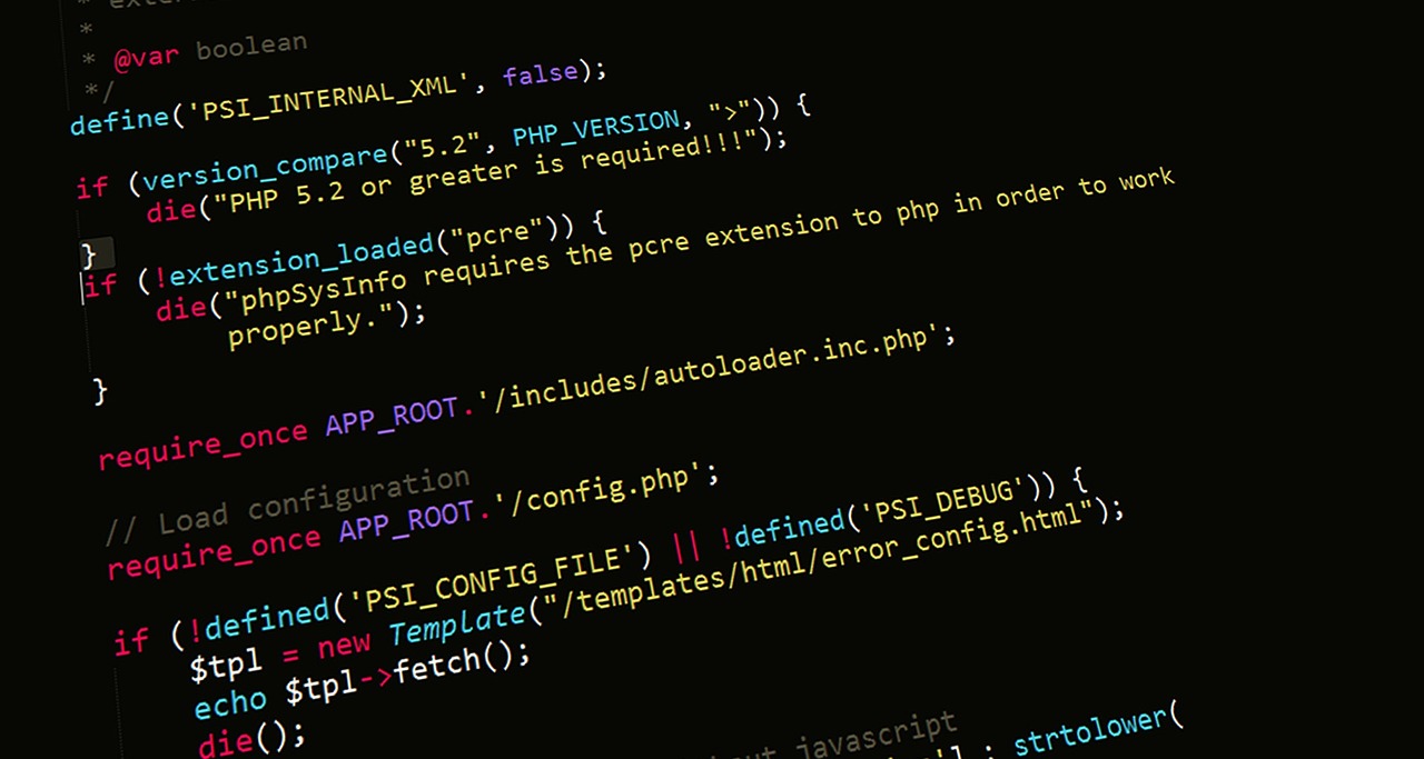 PHP source code on a dark screen, showing version_compare and require_once statements